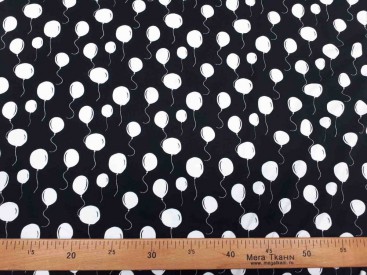 Een zwarte tricot met witte ballonnetjes.Oekotex stof 95% katoen/5% elastan 1.50 mtr.breed