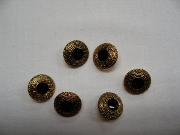 Goudkleurige kunststof klederdracht knoop met zwart. 15 mm. doorsnee. 