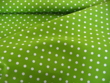 Limegroene katoen met middelgrote witte stip.  Doorsnee stip is ongeveer 6 mm.  100% katoen  1.40 meter breed