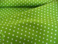 Limegroene katoen met middelgrote witte stip.  Doorsnee stip is ongeveer 6 mm.  100% katoen  1.40 meter breed