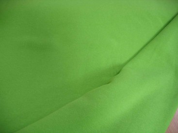 Lime kleurige joggingstof. Deze sweatstof is ook een heel geschikte stof voor huispakken.  80%co/20%pe  1.50 mtr.br.  245 gram/m