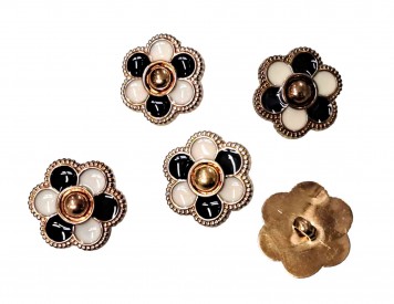 Een goudkleurige kunststof bloemknoop op een steeltje  Een 2-kleurige zwart/witte bloem  Doorsnee ongeveer 20 mm