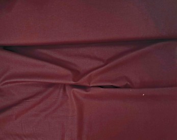 Effen katoen in de kleur donkerbruin.  100% katoen  1.45 mtr. breed.  130 gram/m2