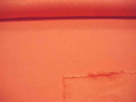 Oranje joggingstof. Deze sweatstof is ook een heel geschikte stof voor huispakken.  80%co/20%pe  1.50 mtr.br.  245 gram/m2