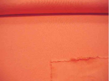 Oranje joggingstof. Deze sweatstof is ook een heel geschikte stof voor huispakken.  80%co/20%pe  1.50 mtr.br.  245 gram/m2