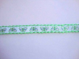 Wit sierband met lime/gele vlinders en een limekleurige ruche. 15 mm. breed