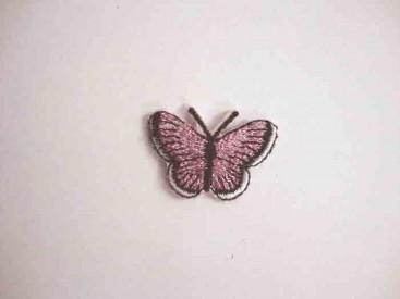Een opstrijkbare vlinder applicatie van 3 x 2.5 cm. Roze glitter