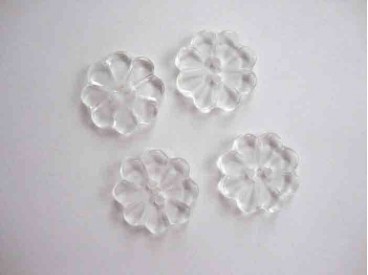 Een wit doorschijnende kunststof bloemknoop met een doorsnee van 25 mm.